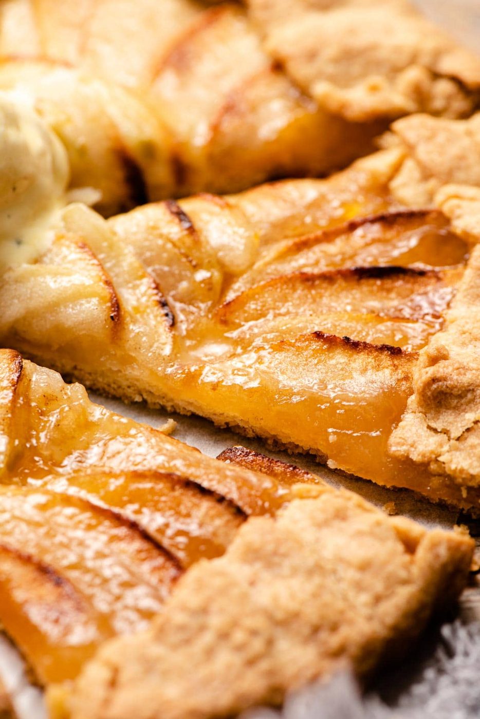 A close up of a slice of Apple Crostata and Apricot Jam