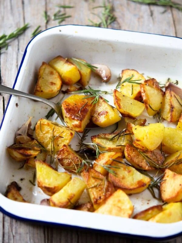 A tray of Italian roast potatoes with garlic and rosemary