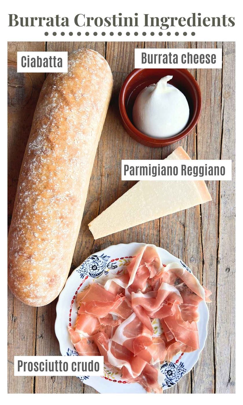 An overhead shot of all the ingredients needed to make burrata crostini with parmigiano and crispy prosciutto.