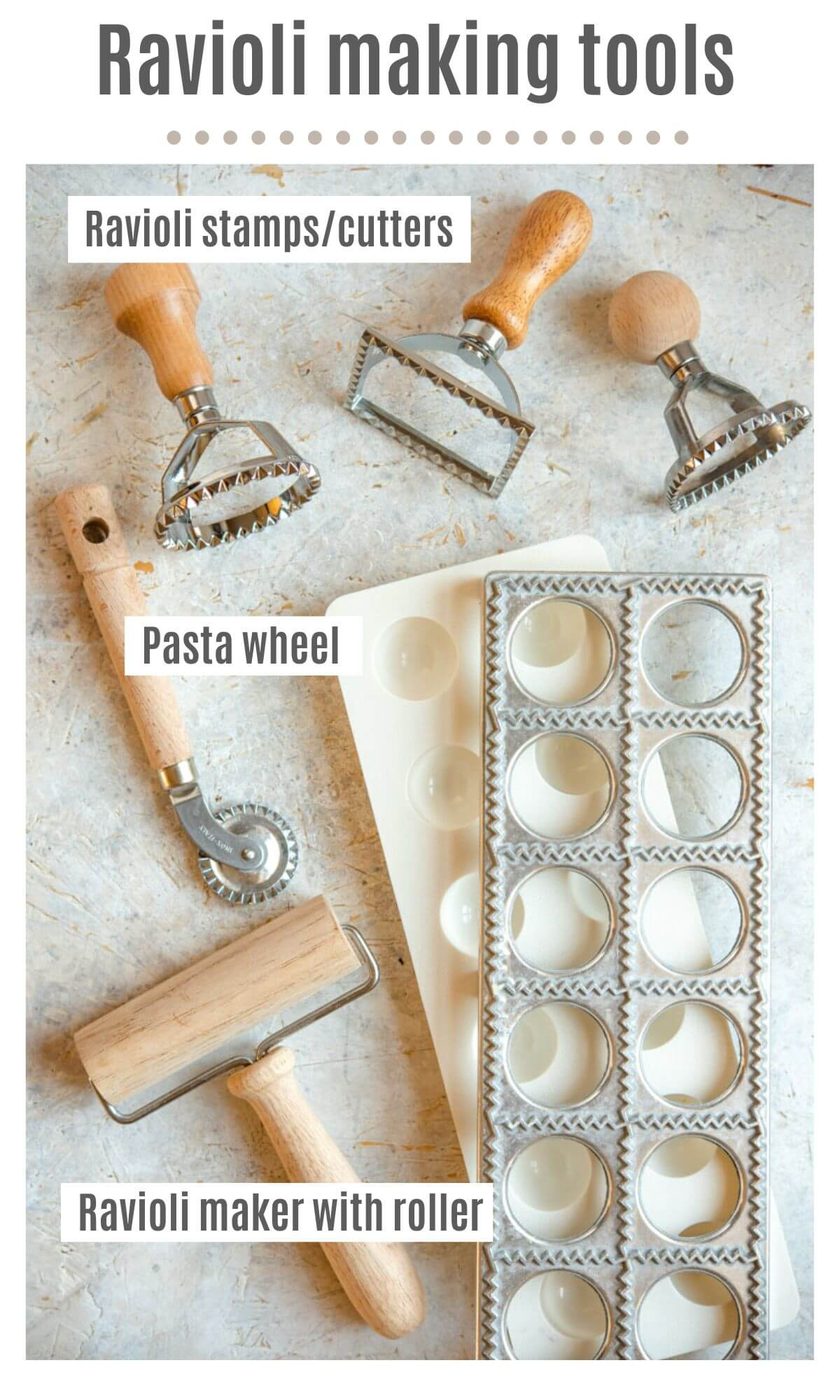 An overhead shot of ravioli making tools labelled; ravioli stamps/cutters, pasta wheels and ravioli maker with roller.