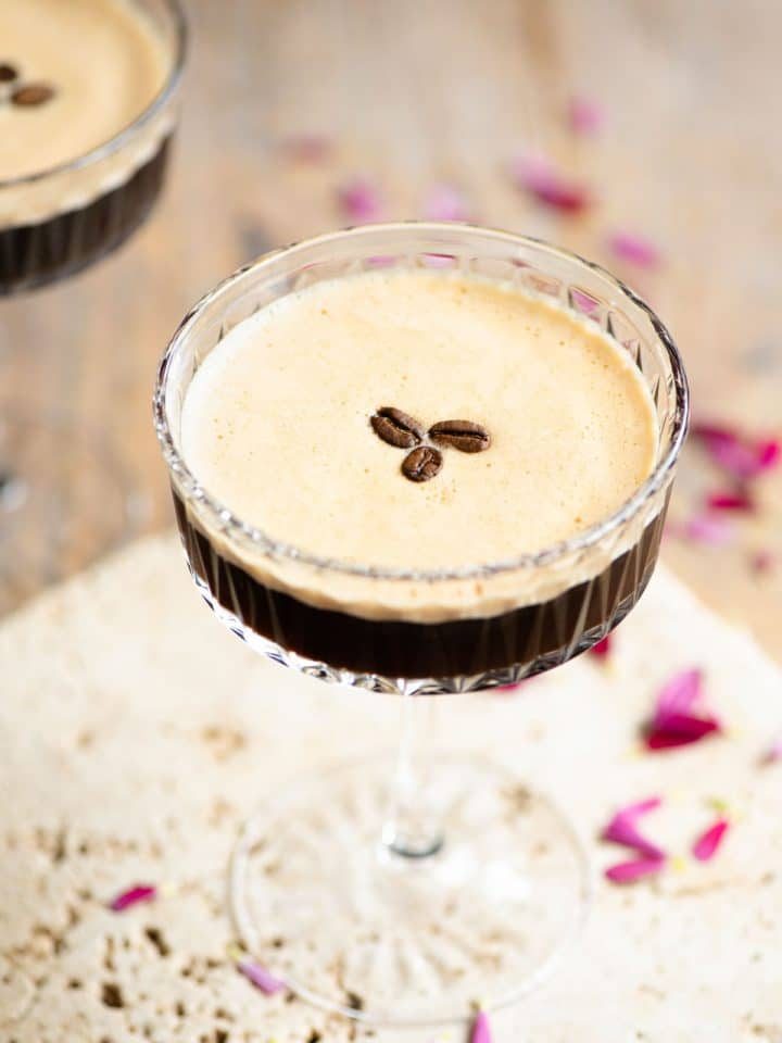 An espresso martini with 3 coffee beans on top