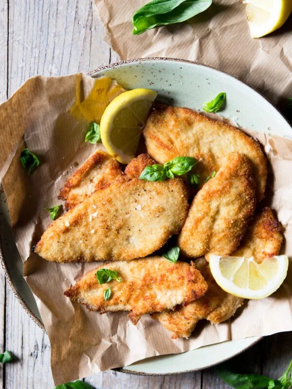 An overhead shot of breaded chicken cutlets