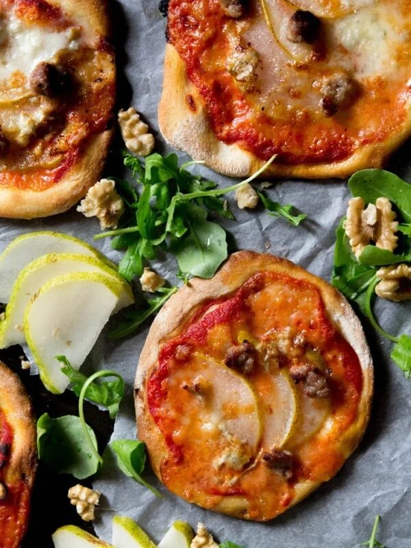 mini sausage pizzas with gorgonzola and pear