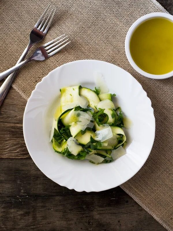 A fresh, Summer Zucchini Ribbon Salad with a simple tart lemon dressing, arugula, and shavings of parmesan. It's light, easy and super delicious.