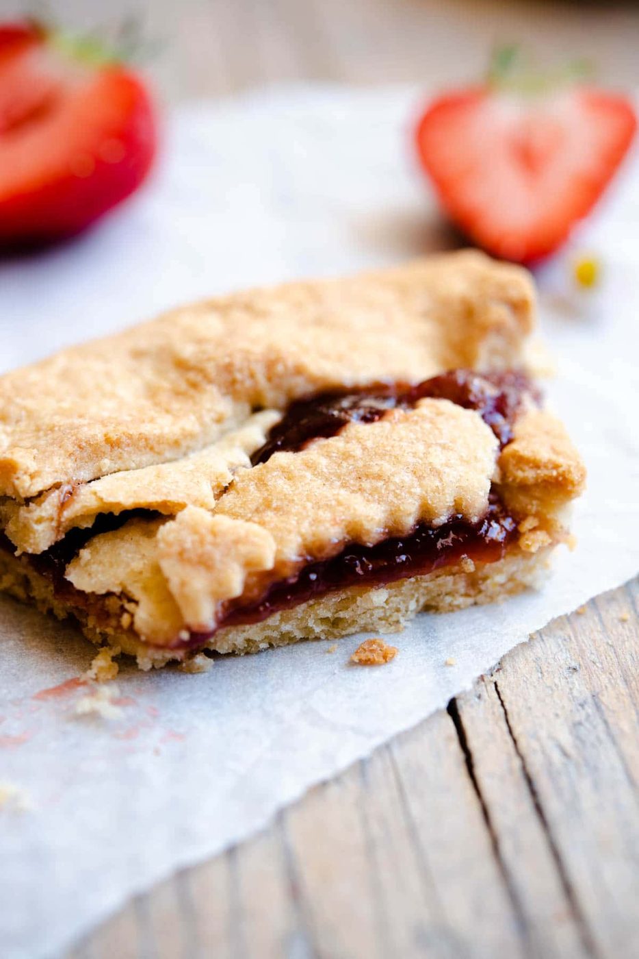 A close up of a slice of Italian crostata cut in half