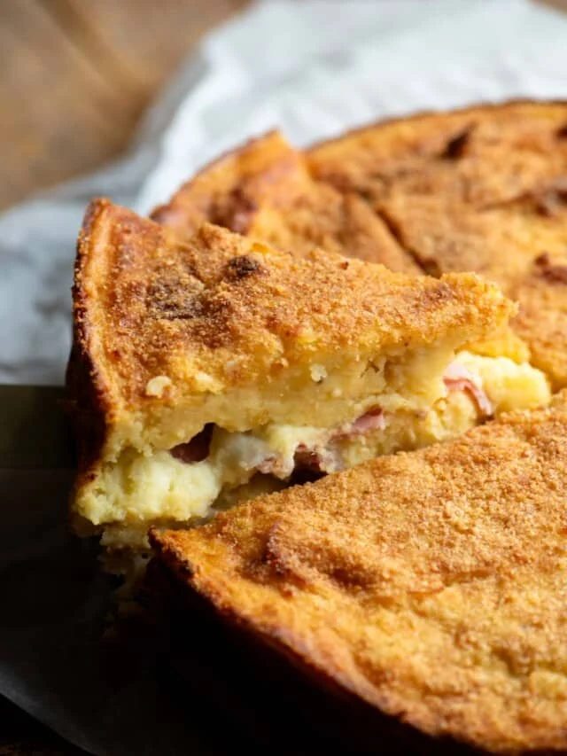 A close up of a slice of Neapolitan potato cake.