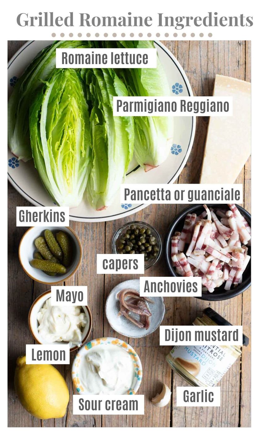 An overhead shot of all the ingredients needed to make a grilled romaine salad with a creamy dressing and pancetta.