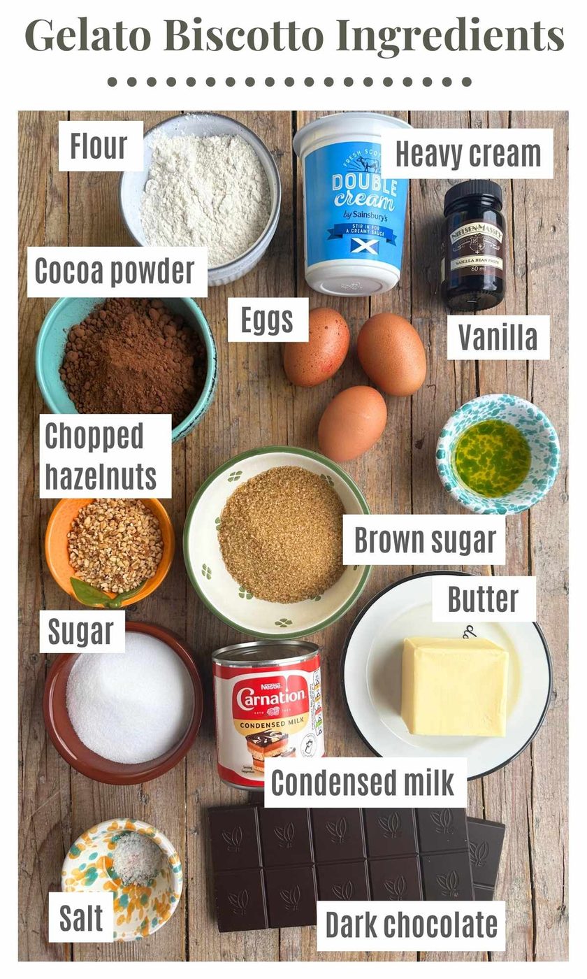 All the ingredients needed to make chocolate and vanilla ice cream sandwiches sitting on a wooden background.