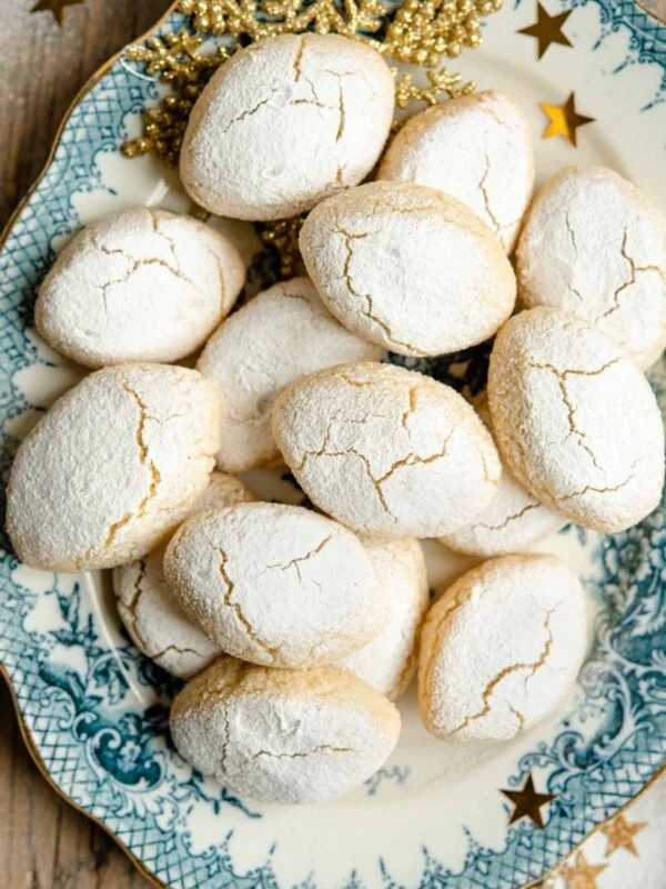 An overhead shot of Ricciarelli almond cookies on a plate