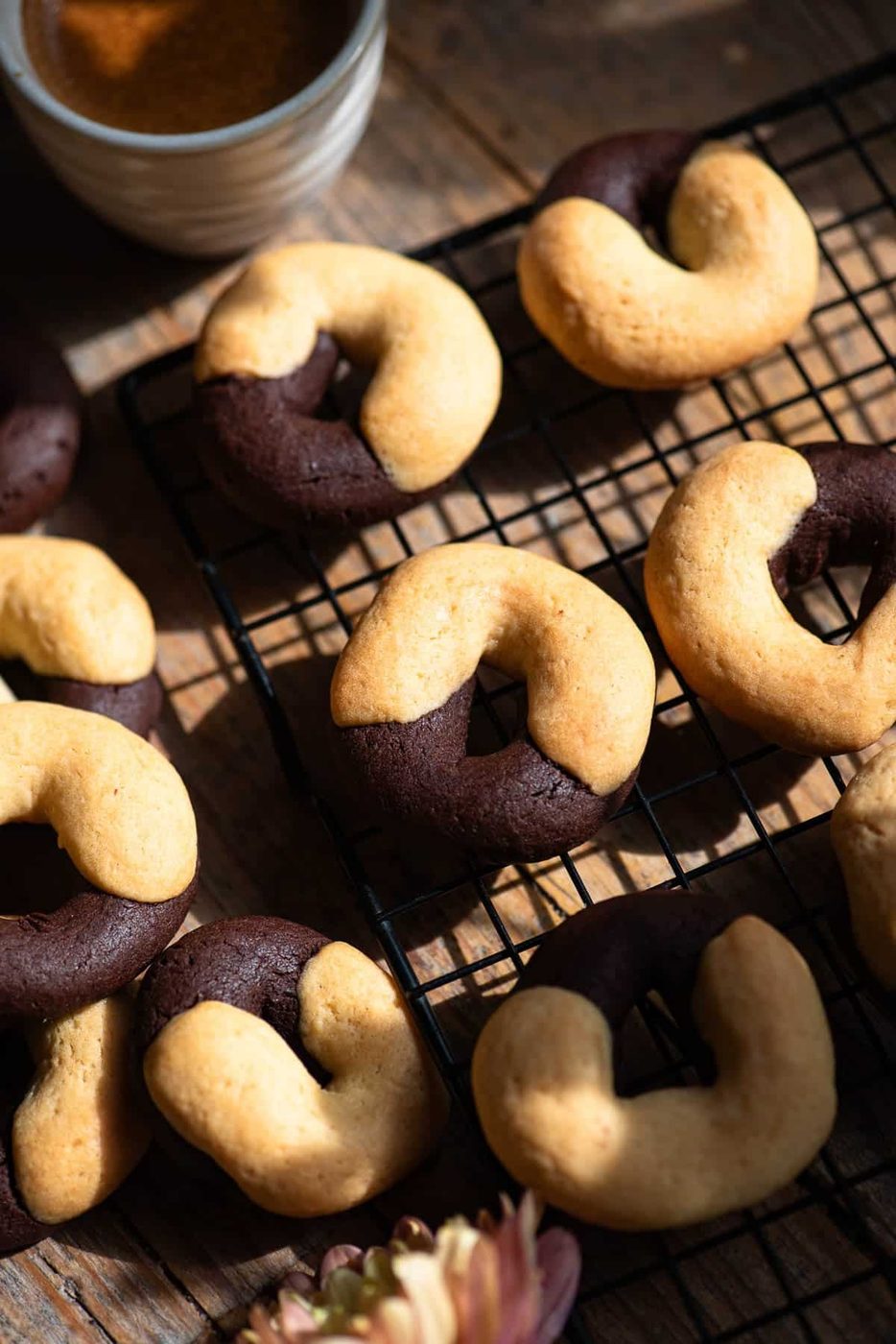 A close up of Italian Abbracci Cookies, Chocolate and Cream on a cooling rack.