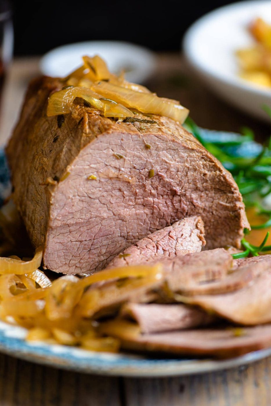 A close up of Itlaian roast beef with onions
