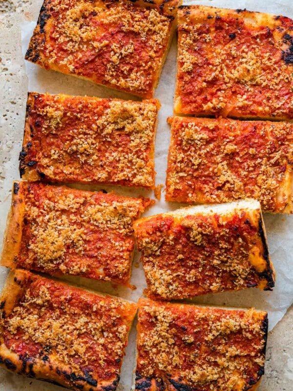 An overhead shot of a pan pizza cut into slices