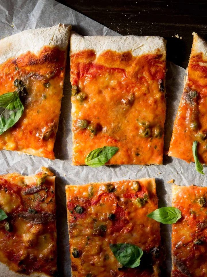 A close up of anchovy pizza (pizza napoli) with capers