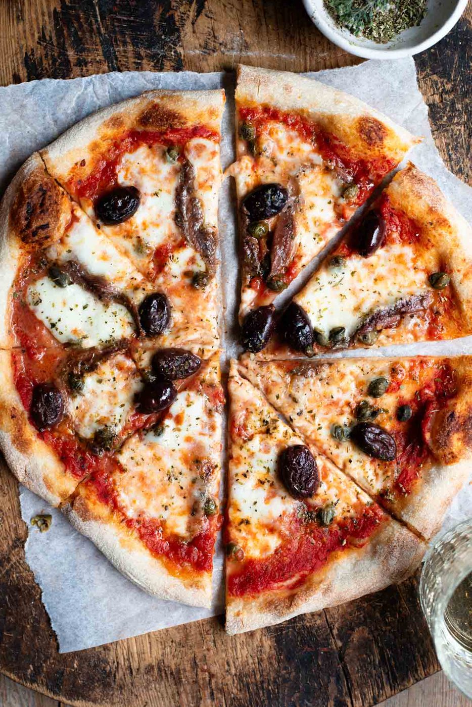 Pizza with Olives, Anchovies, Capers and Oregano