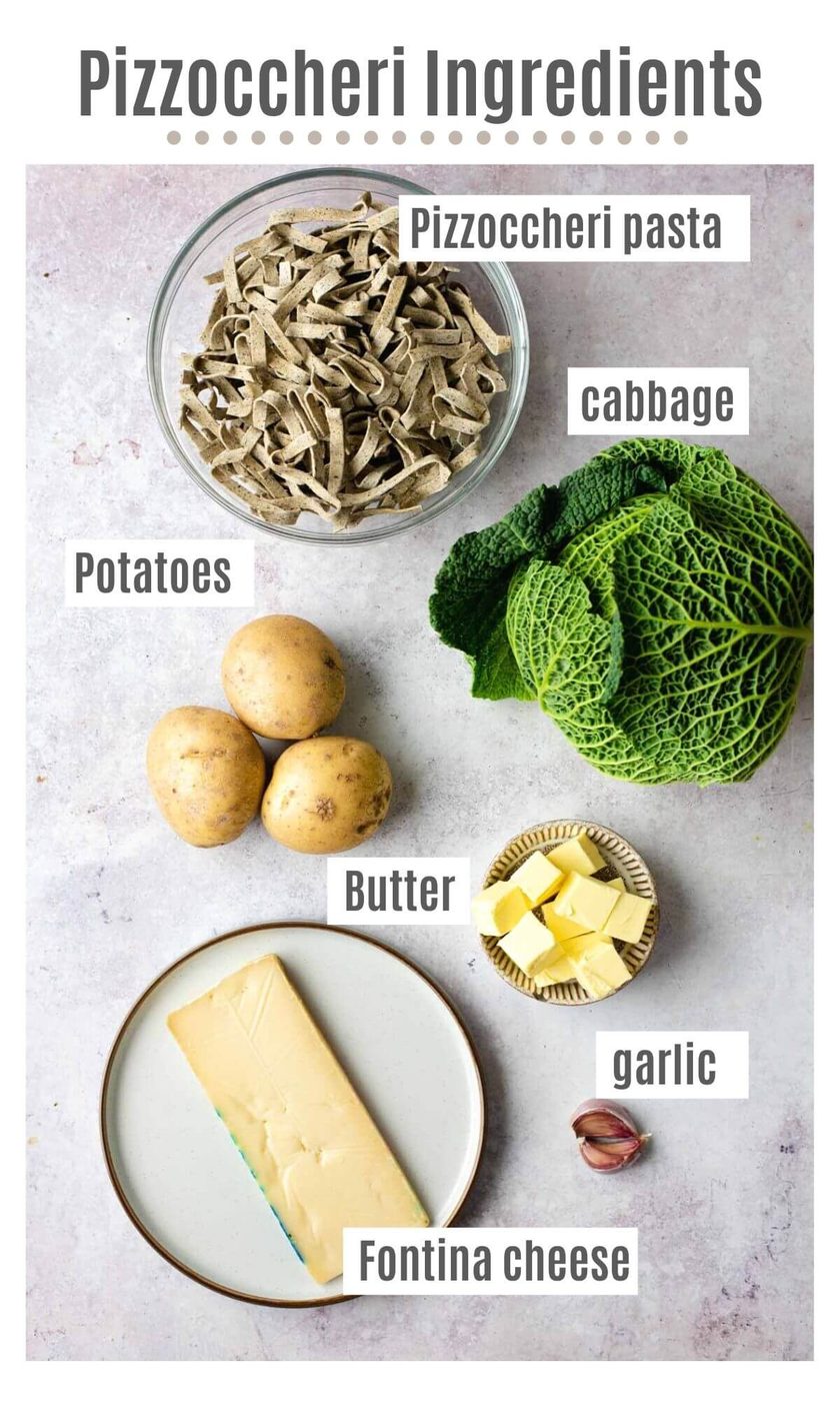An overhead shot of all the ingredients you need to make Pizzoccheri Pasta, plus Potatoes and Cabbage