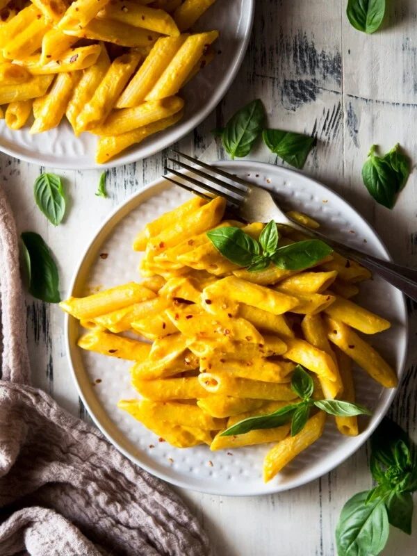 butternut squash pasta in a plate with basil