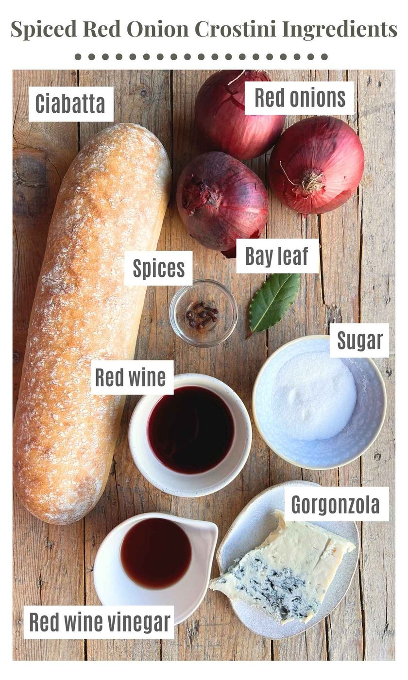 An overhead shot of all the ingredients needed to make red onion and gorgonzola crostini.