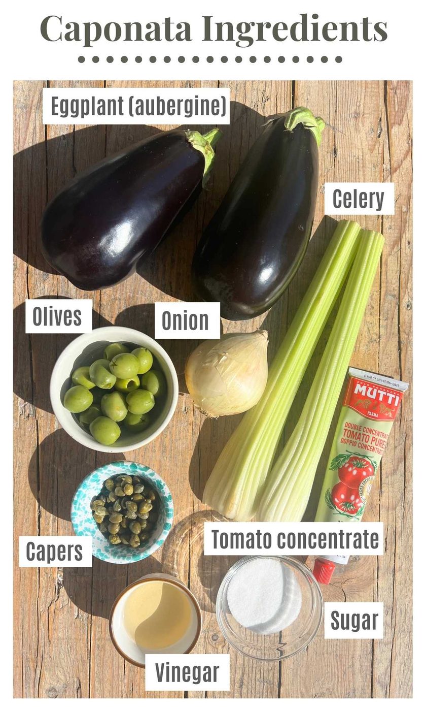 All the ingredients needed to make caponata on a wooden surface.