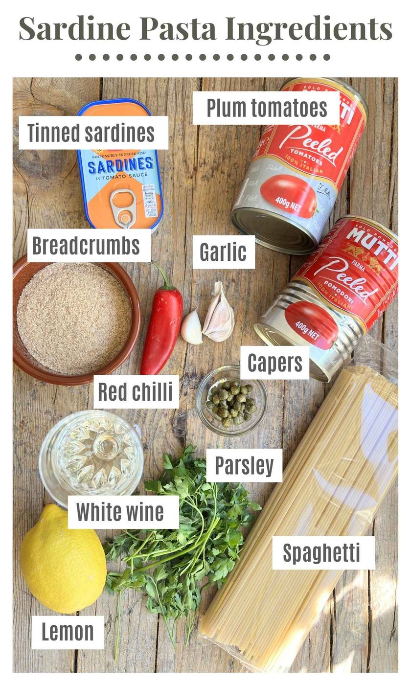 An overhead shot off all the ingredients needed to make sardine pasta with tomatoes, chilli and breadcrumbs.