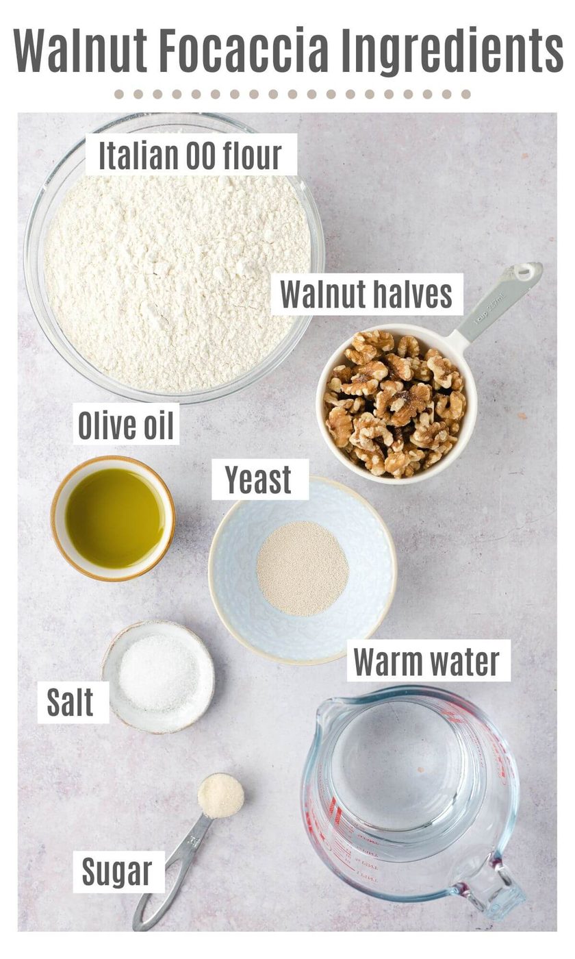 An overhead shot of all the ingredients you need to make a walnut focaccia