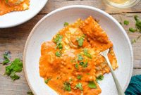 Elegant Lobster Ravioli with Spirited Cream