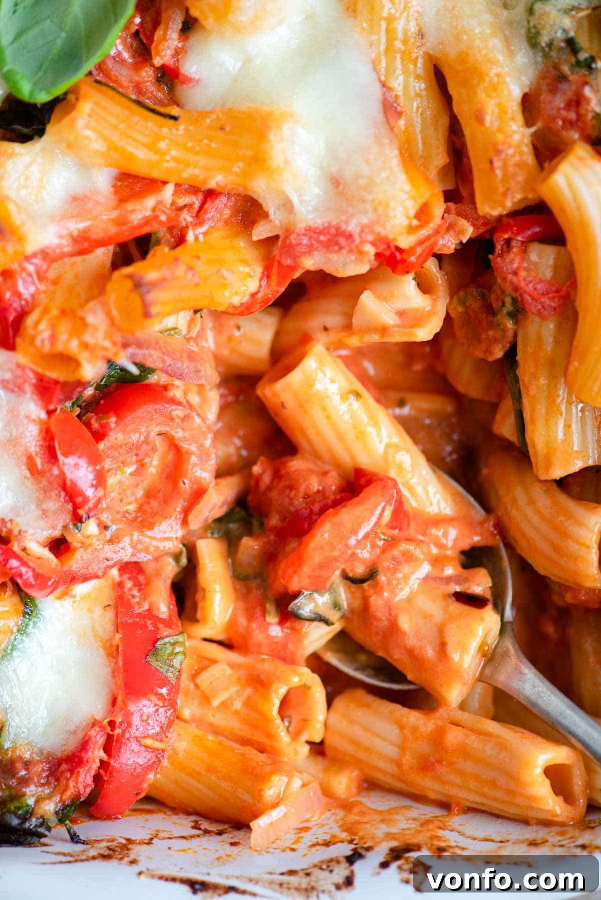 Veggie Lover's Baked Ziti 7 A close up of baked ziti with vegetables in a tomato sauce
