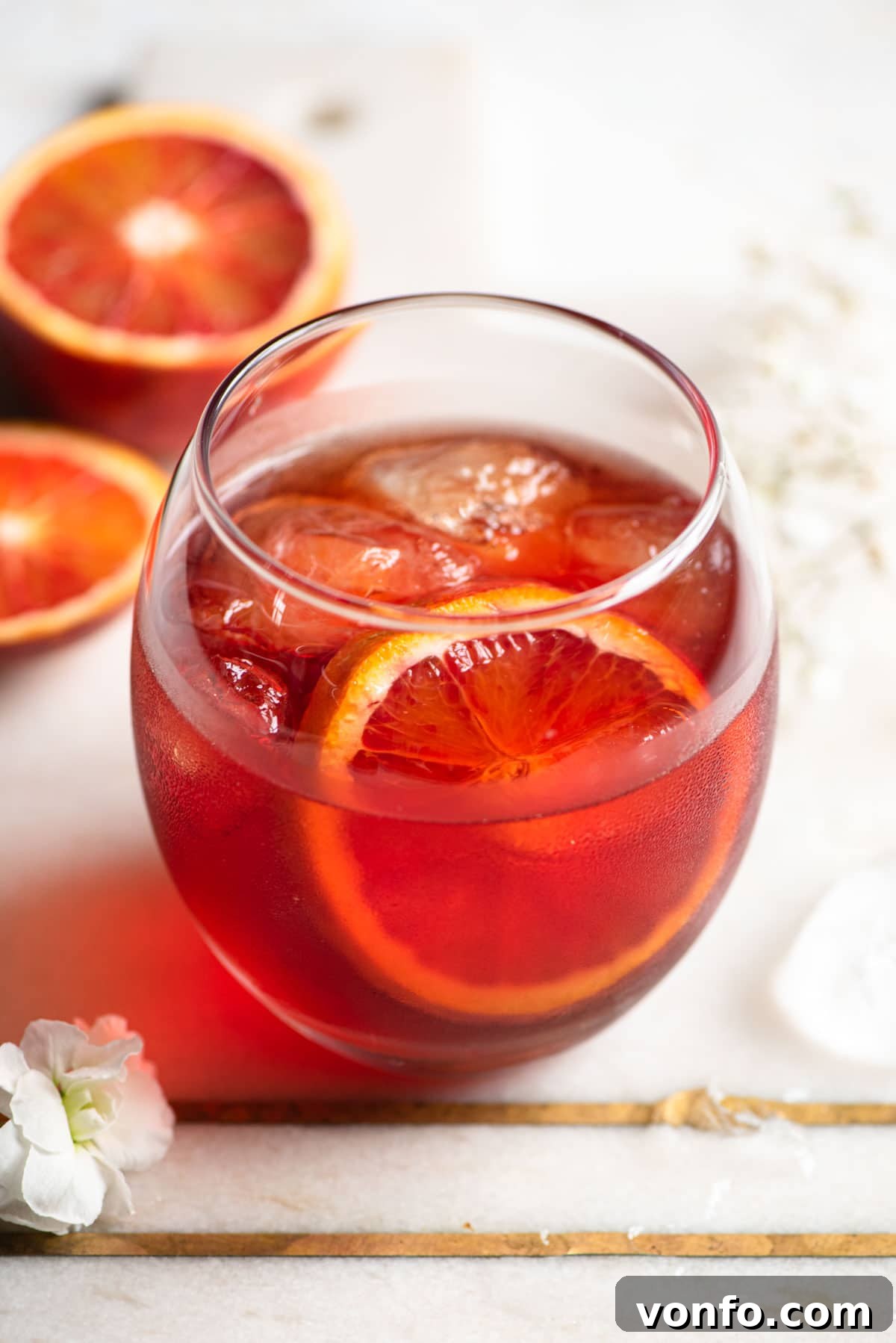 A close up of a Negroni Sbagliato in a round glass