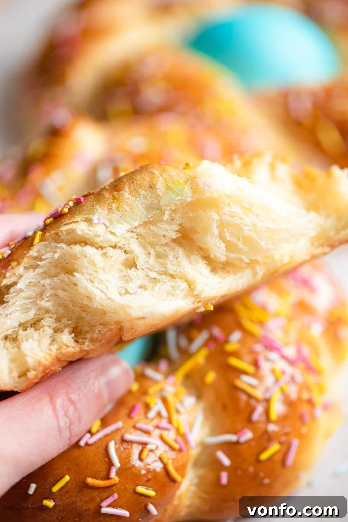A close-up shot of the soft, fluffy interior crumb of a freshly baked Italian Easter bread, revealing its tender texture.