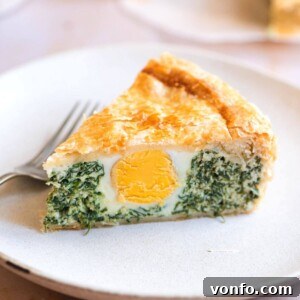A close up of a slice of Torta Pasqualina