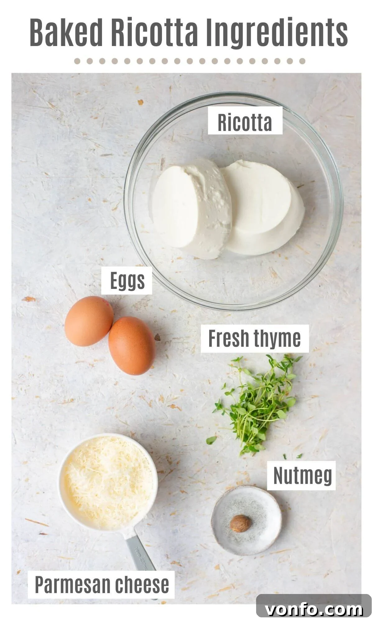 An overhead shot showcasing all the fresh and essential ingredients required to prepare a delectable baked ricotta: ricotta cheese, fresh thyme, eggs, Parmesan cheese, nutmeg, salt, pepper, and butter.