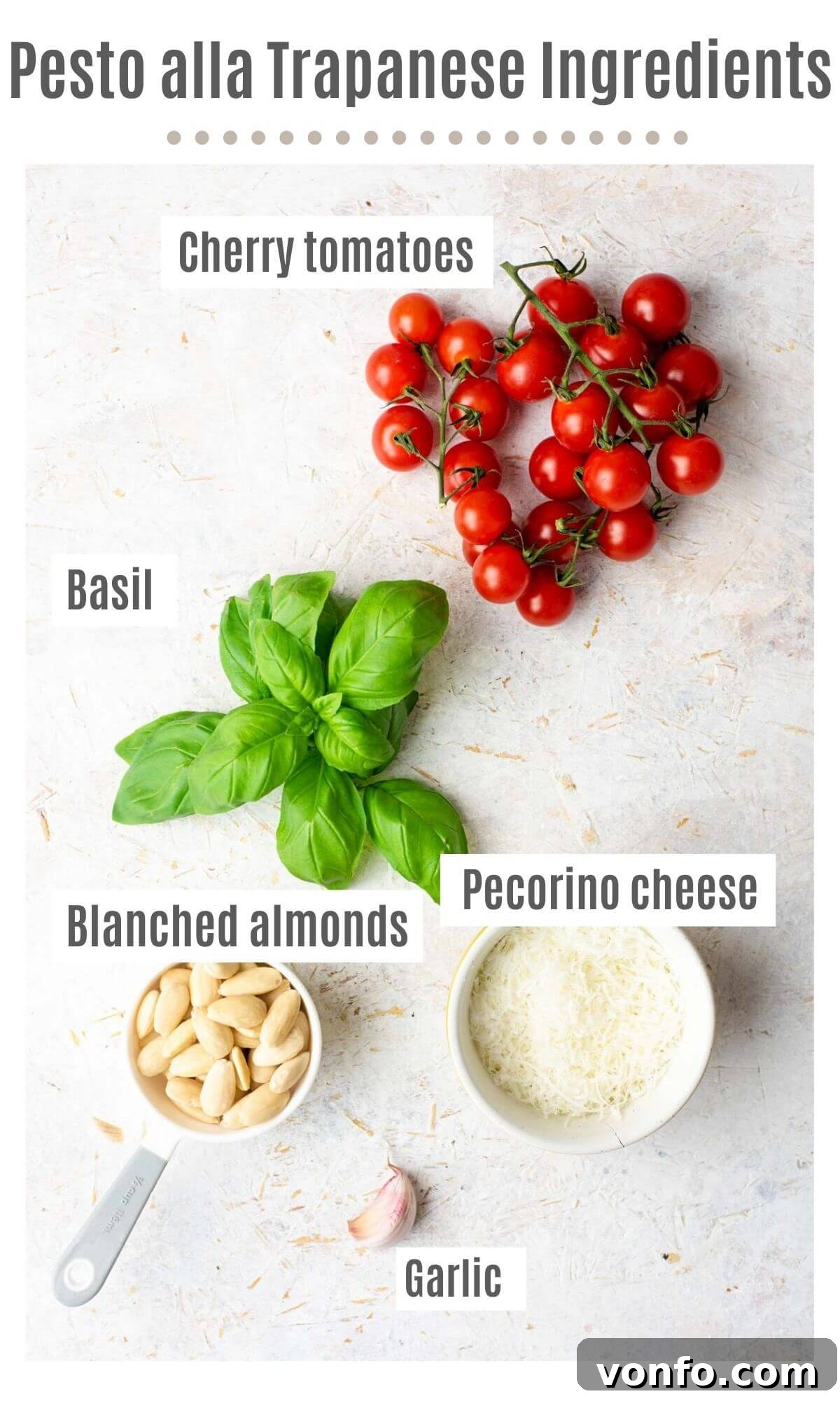 An overhead shot of all the fresh ingredients needed to make Pesto alla Trapanese