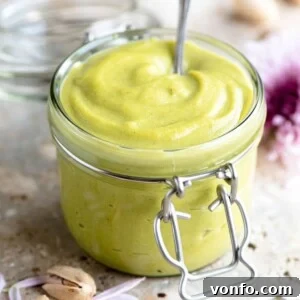 A close up of Italian pistachio cream in a jar, ready to be served.