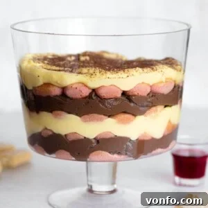 A close up of zuppa inglese in a glass trifle dish