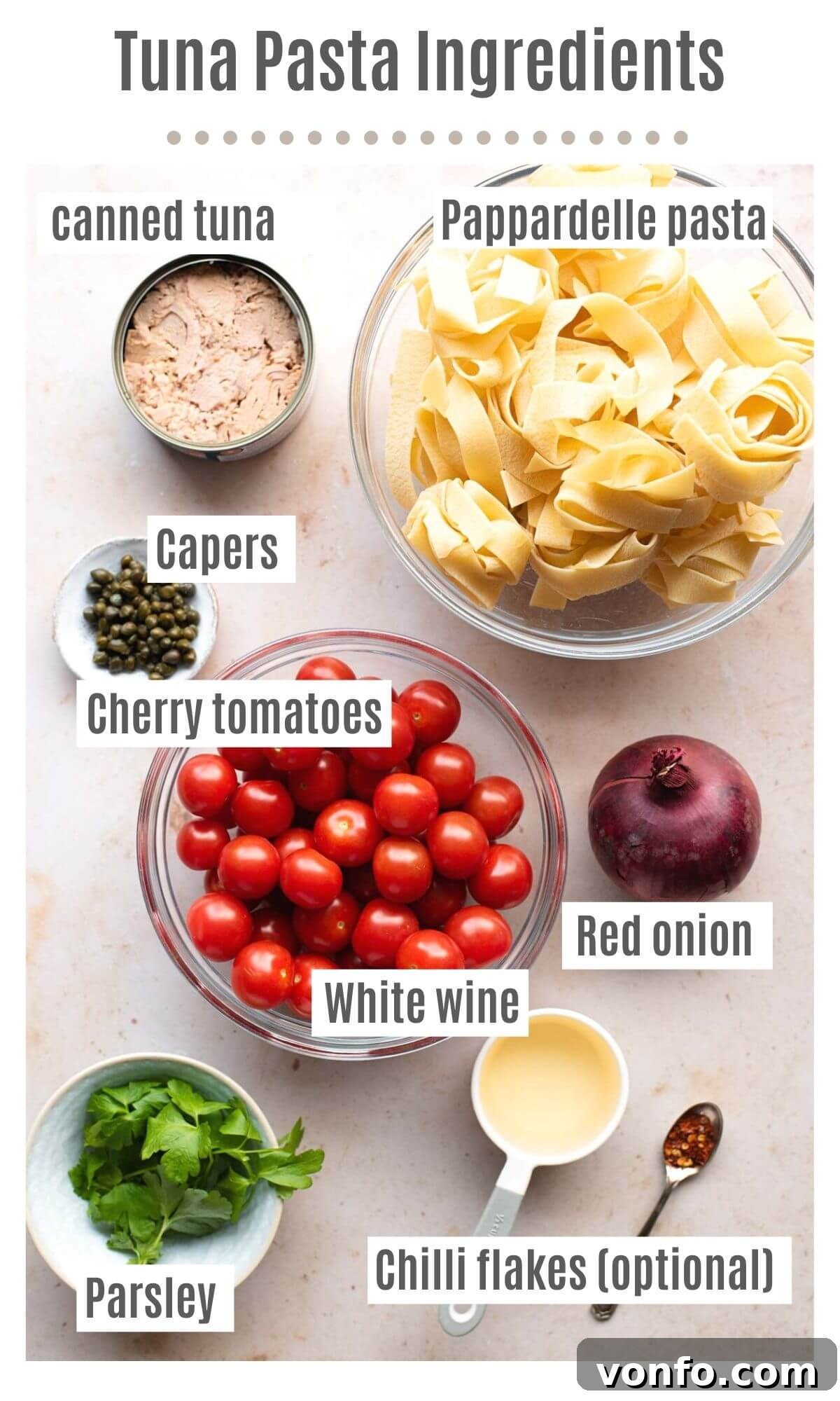 Quick Tuna Pasta with Burst Tomatoes and Briny Capers 3 An organized overhead display of all the fresh ingredients required to prepare a delicious tuna pasta dish.