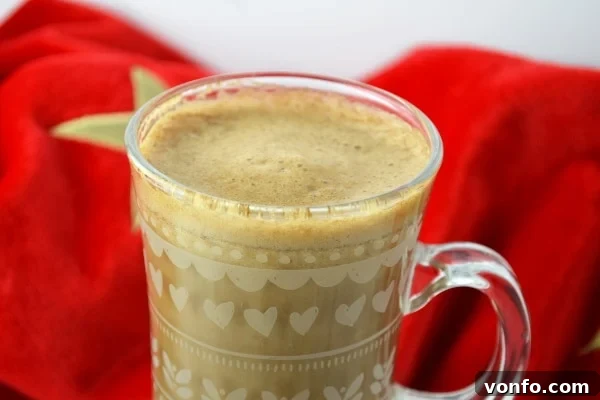 Cozy Banana Coffee Delight A close-up view of warm banana milk coffee in a ceramic mug, with a hint of steam rising, inviting a cozy sip.