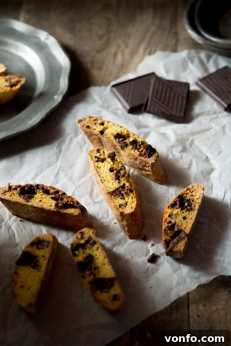 Delicious Orange Chocolate Cantucci biscuits beautifully arranged on a rustic wooden board, capturing the essence of authentic Italian baking.