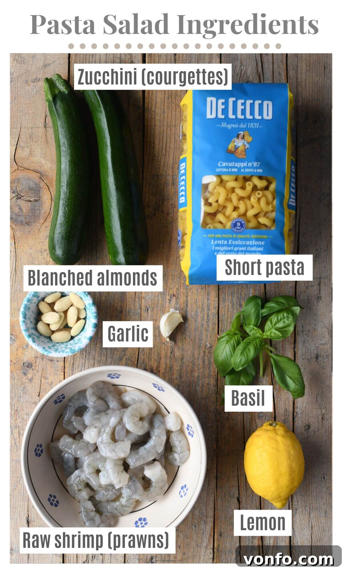 Zesty Shrimp & Zucchini Pasta Salad 3 An overhead shot of all the ingredients needed to make a zucchini and shrimp pasta salad.