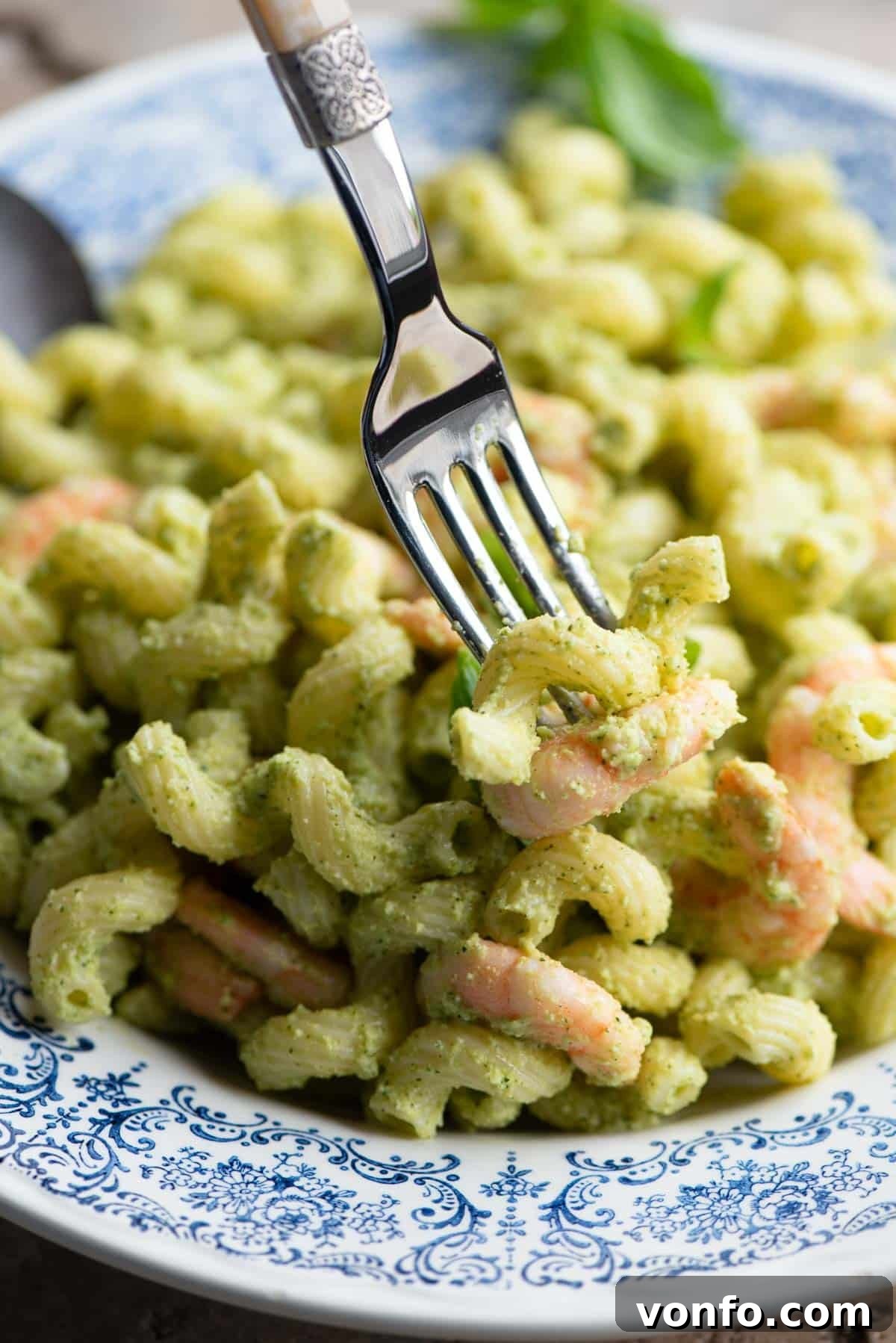 Zesty Shrimp & Zucchini Pasta Salad 7 A close up of zucchini pasta and shrimp on a fork.
