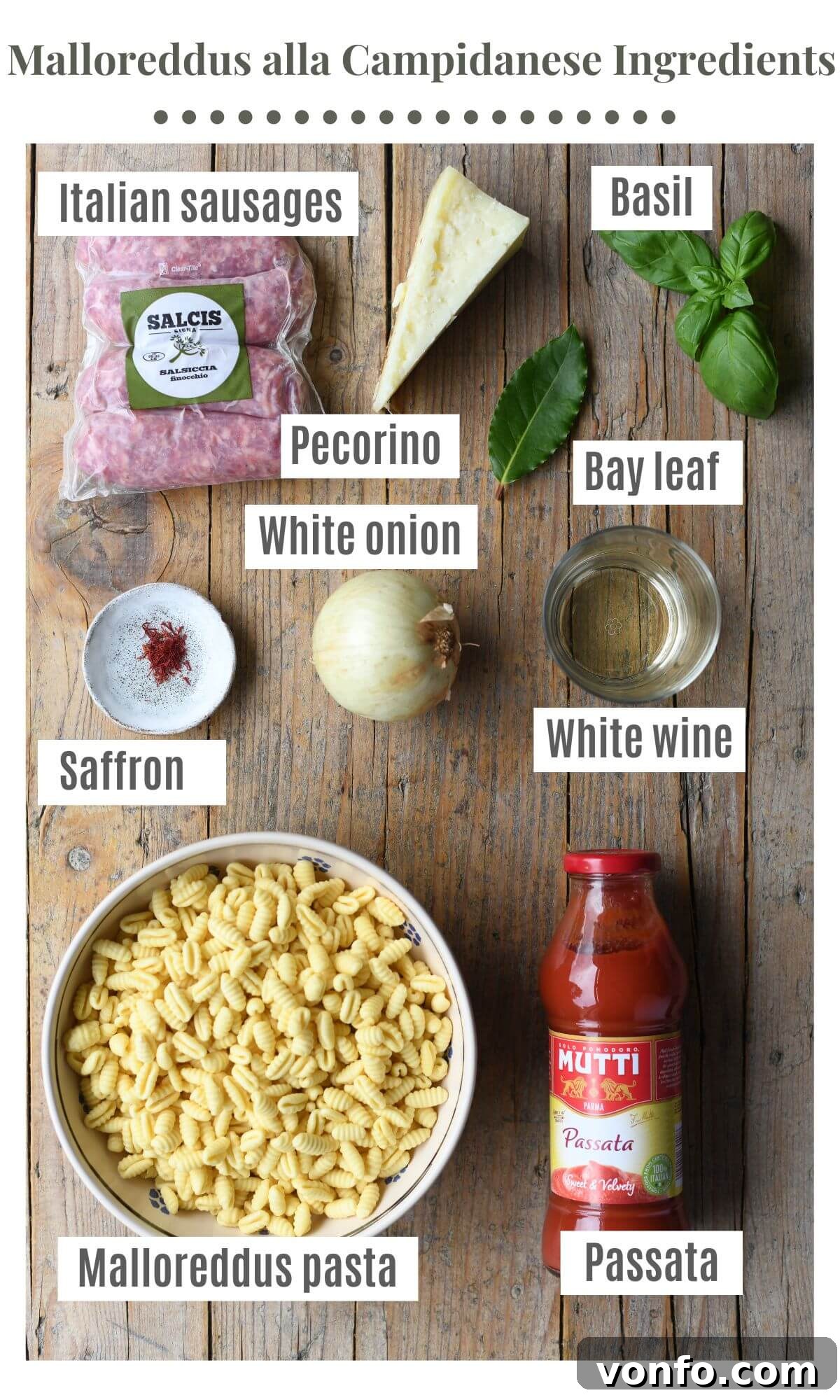 An overhead shot of all the ingredients needed to make Malloreddus alla Campidanese, neatly arranged on a rustic wooden surface.