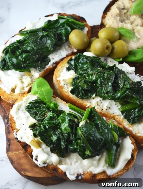 Stracchino and spinach crostini, a creamy and fresh appetizer