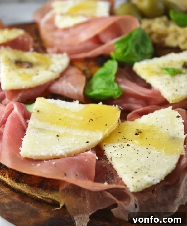 Prosciutto, Pecorino, and honey crostini, an exquisite sweet and savory bite