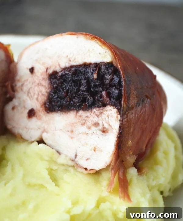Close-up of Black Pudding Stuffed Chicken with Cheesy Leeks, showcasing the rich textures and savory filling