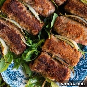 A close up cropped image of Sicilian involtini, showcasing their golden-brown exterior.
