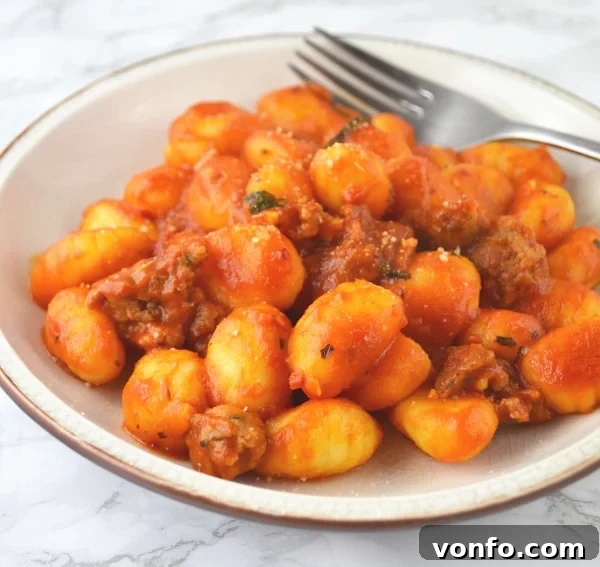 Delicious Gnocchi with spicy 'Nduja tomato sauce, ready to be served for a warm, comforting meal.