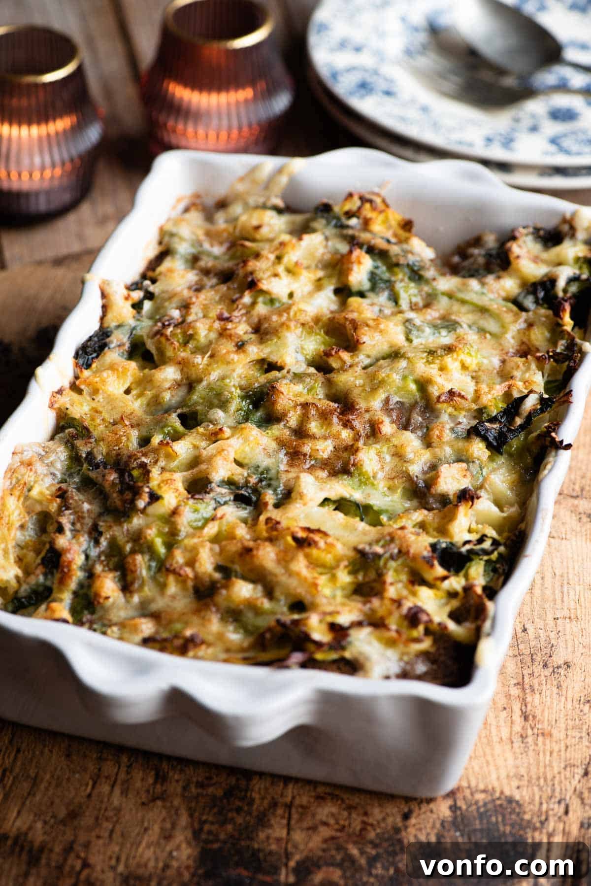 A perfectly baked Zuppa Valpellinese in a rustic rectangular baking dish, placed on a weathered wooden board, steam gently rising.