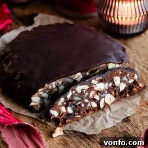 Panpepato Rich Christmas Spice 8 A delicious slice of Panpepato on a wooden board