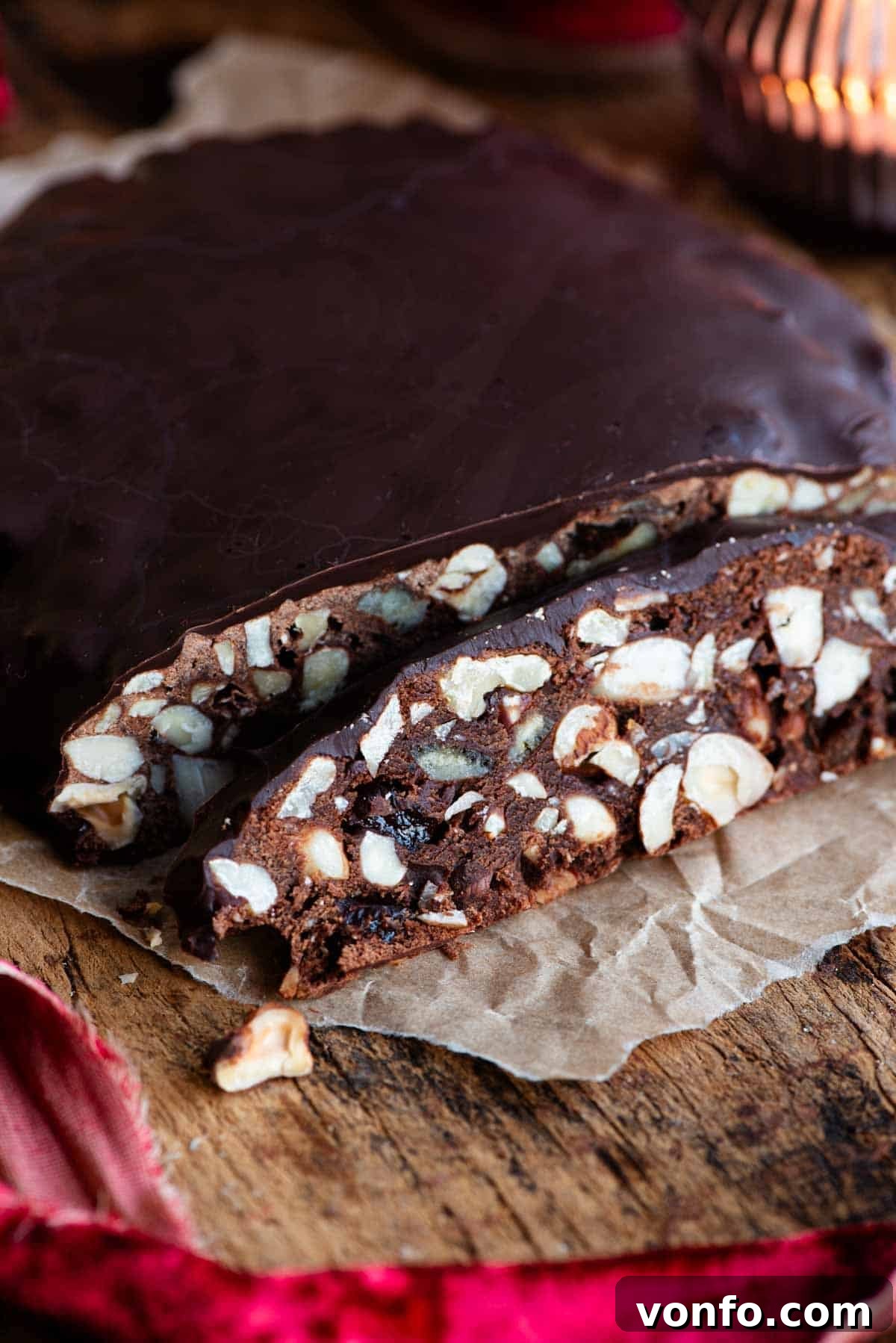 Panpepato Rich Christmas Spice 7 A close up of a slice of Panpepato filled with nuts and dried fruit.
