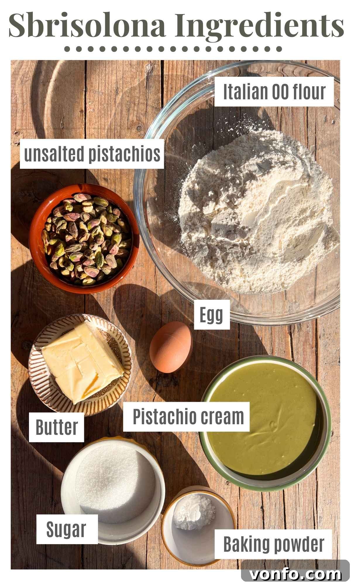 Rustic Italian Pistachio Crumb Cake 3 All the essential ingredients for an Italian pistachio crumb cake laid out in bowls, including flour, unsalted pistachios, cold butter, egg, sugar, baking powder, and a jar of pistachio cream.
