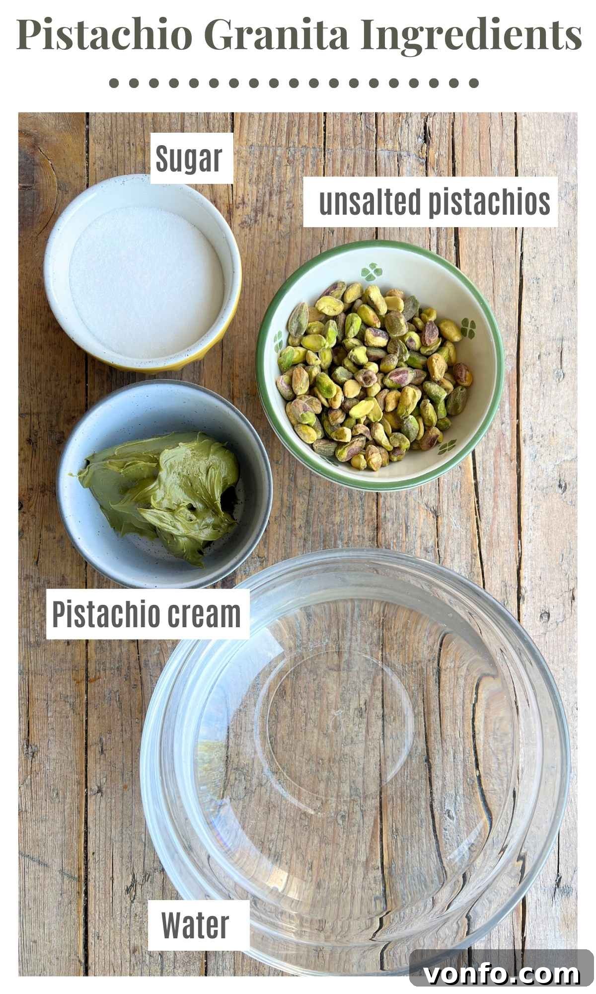 Ingredients for pistachio granita laid out on a rustic wooden surface: whole pistachios, a jar of rich pistachio cream, granulated sugar, and fresh water, all perfectly portioned for the recipe.