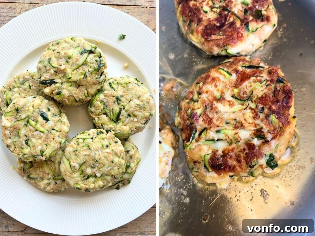 Four zucchini patties frying in a pan with olive oil, browning to a golden crisp.